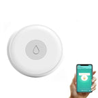 Compact water level sensor installed in laundry room for leak detection
