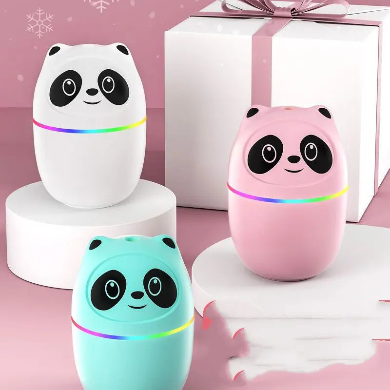 Three panda-shaped night lights in white, pink, and blue on a pink background.