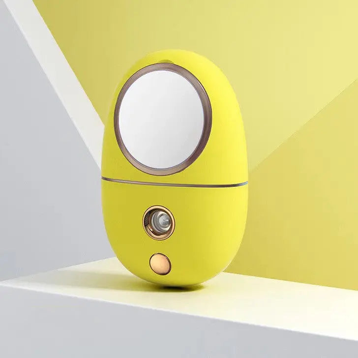 Close-up of facial moisturizer humidifier showing the cold spray mist and 3 gear settings