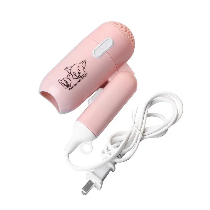 Mini foldable cartoon-style hair dryer in pink color – compact travel blow dryer with cold and hot air settings