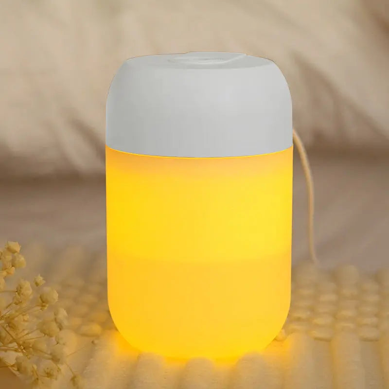 Compact cylindrical humidifier with charging cable for home or office use