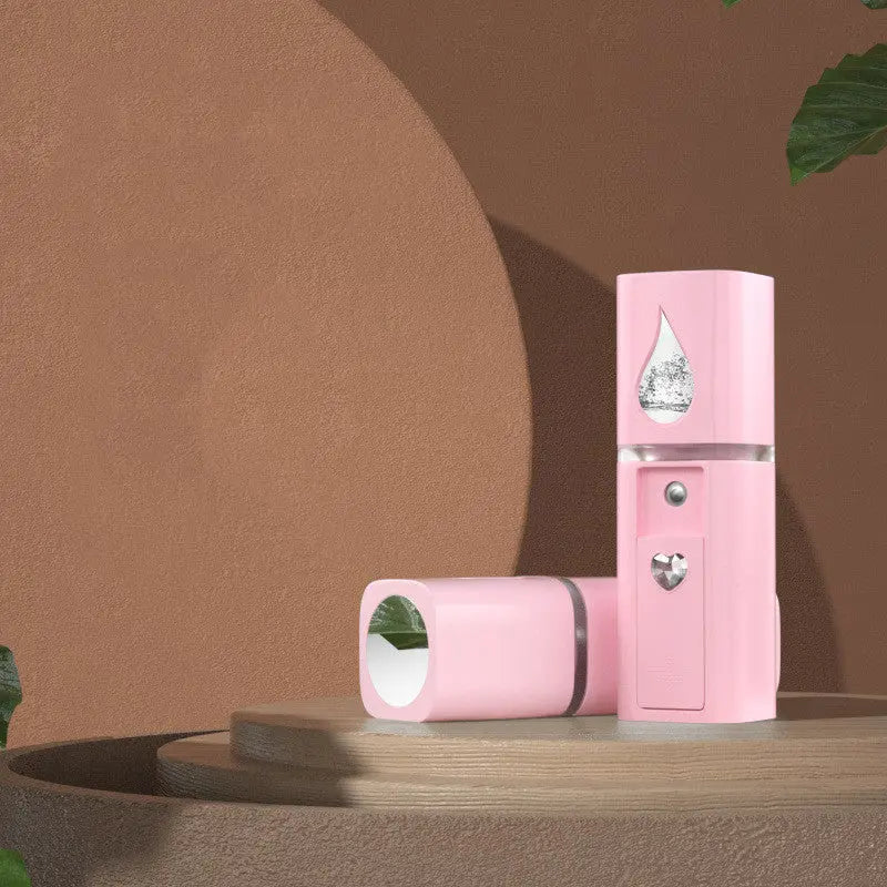 Close-up of facial moisturizer humidifier showing the cold spray mist and 3 gear settings

